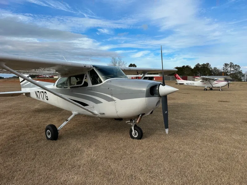 Flight student and instructor near leased plane