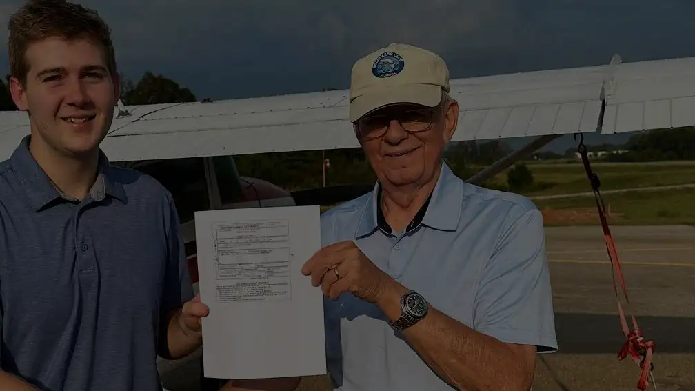 Blue Skies Above student and examiner after a checkride