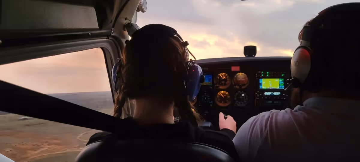 Student pilot in an aircraft with instructor