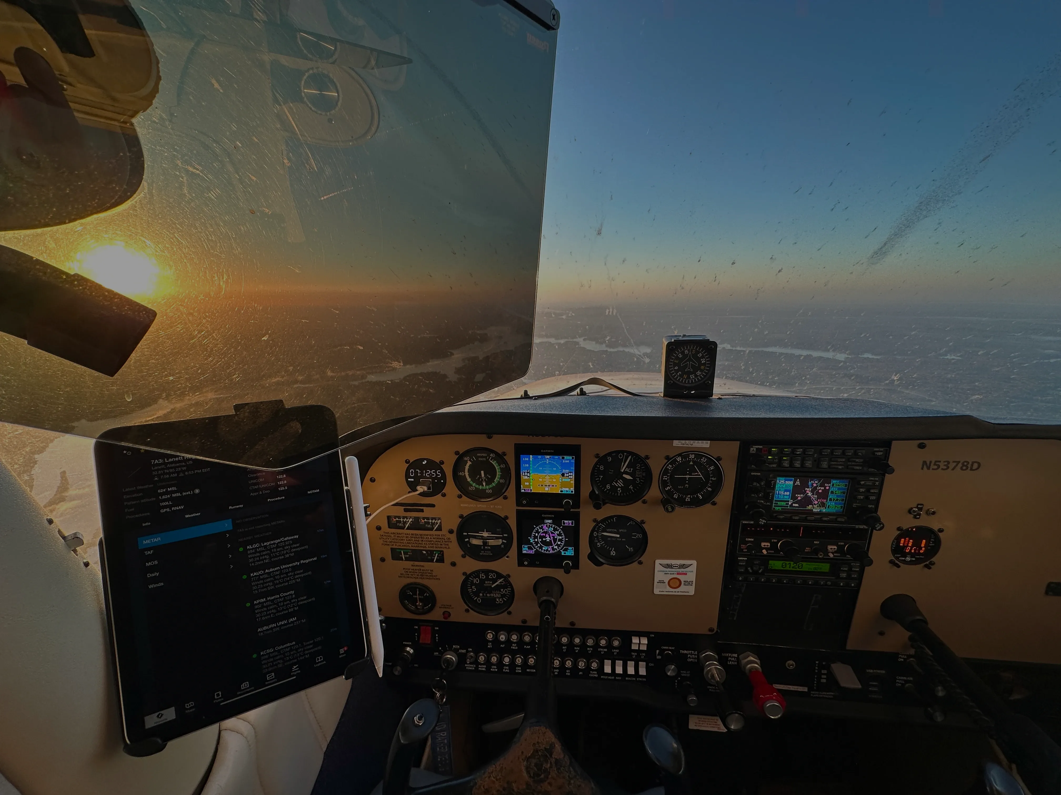 View from a cockpit at sunset, representing the career destination for Blue Skies Above pilots