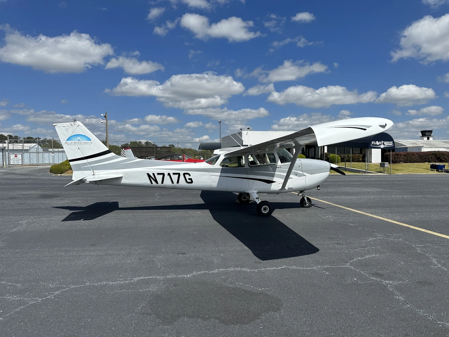 Blue Skies Above Cessna 172 on the ramp