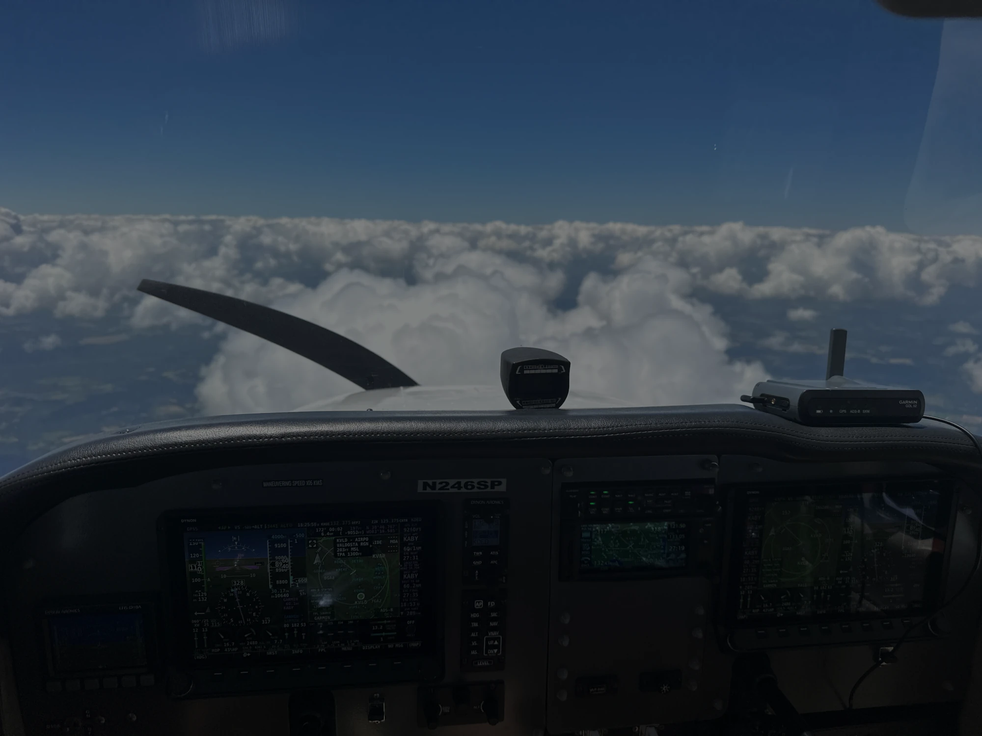 Blue Skies Above Cessna flying near the clouds