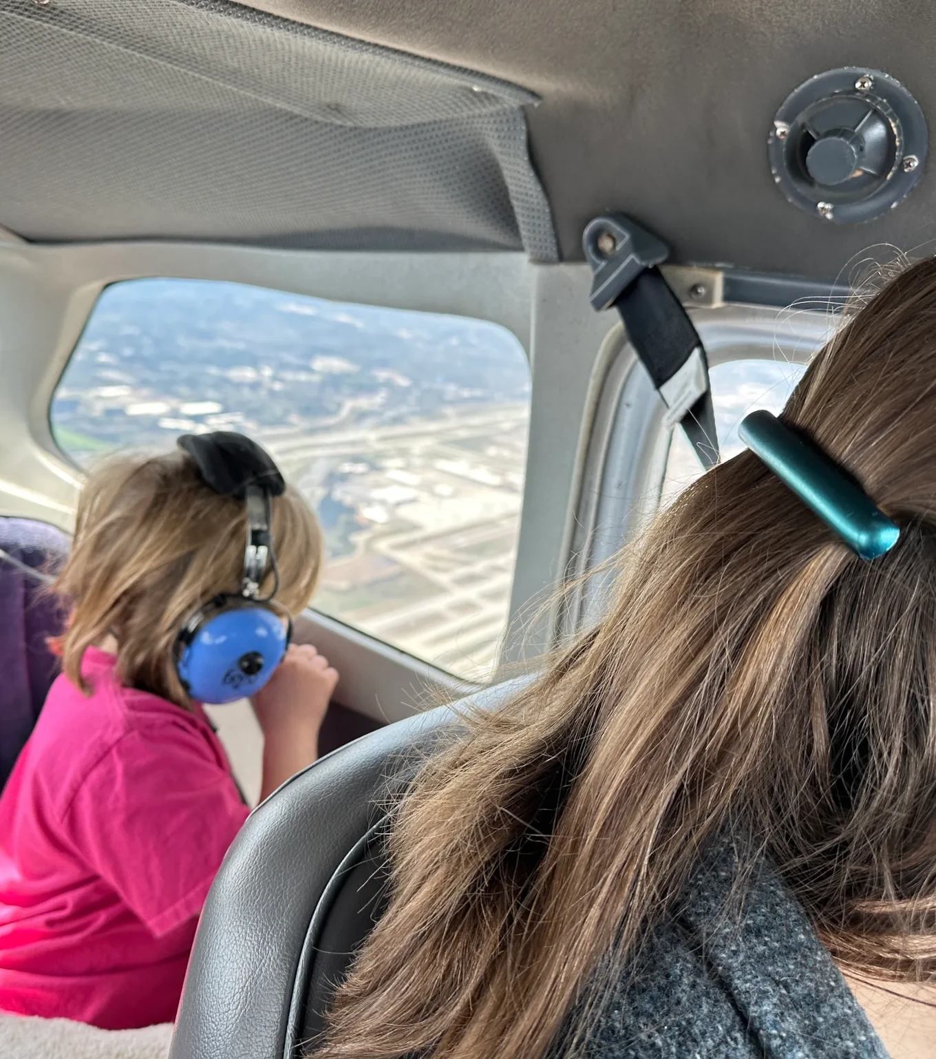 Window view from aircraft flying over the Lanett airport